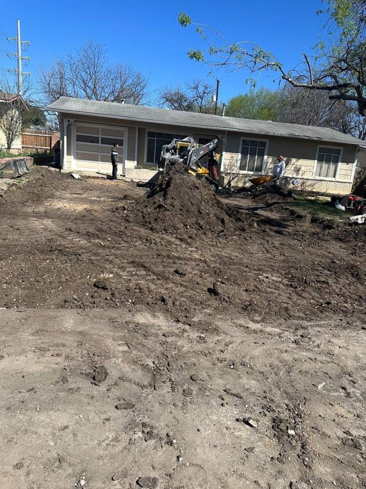 Front yard dug out and graded for a new driveway