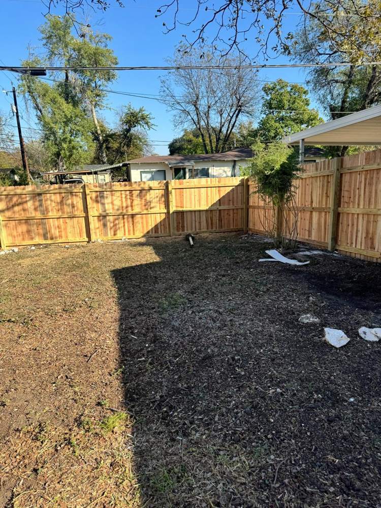 New cedar privacy fence around a backyard