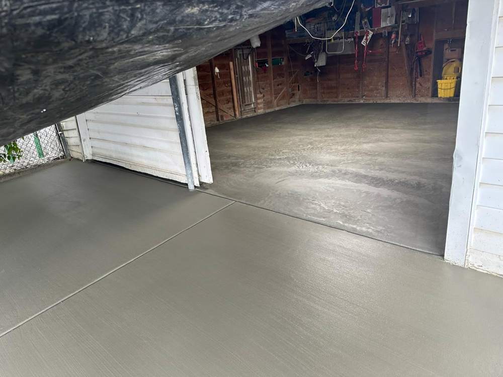 New concrete garage floor and apron, freshly finished