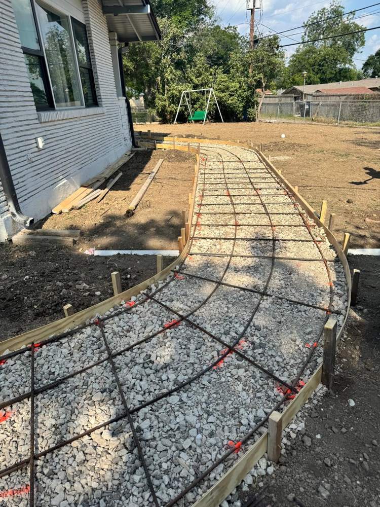 Rebar grid on crushed rock inside curved forms